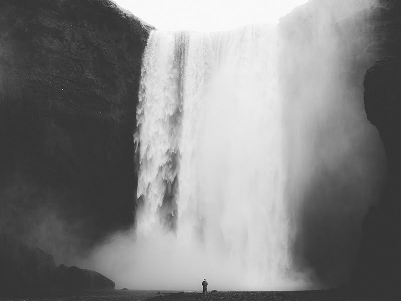 Person at the bottom of a waterfall